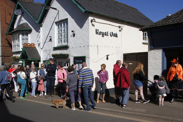 Queues of customers in Porlock High Street for the opening of Nikki Seymour's kitchen and bakery Bake Me Crazy. 