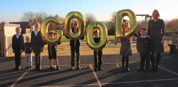 Executive headteacher Claire Luce with Otterhampton Primary School pupils after an Ofsted inspection rated the school 'Good'.