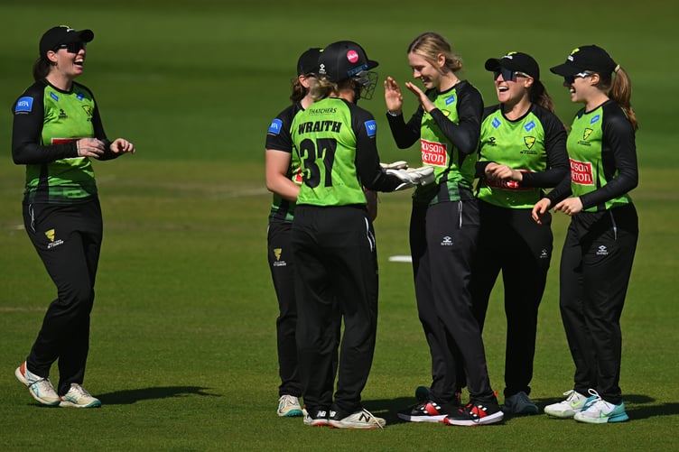 Storm celebrate the fall of a wicket