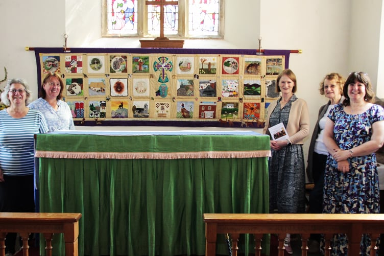 The new wall hanging unveiled in St Petrock's Church, Timberscombe, with (left to right) Marion Moncrieff, Sarah Campbell, Marion Jeffrey, Wendy Cook, and Adele Wealleans.