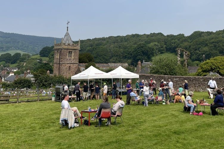 Villagers in Timberscombe enjoyed a family barbecue as a new reredos was unveiled in St Petrock's Church. 