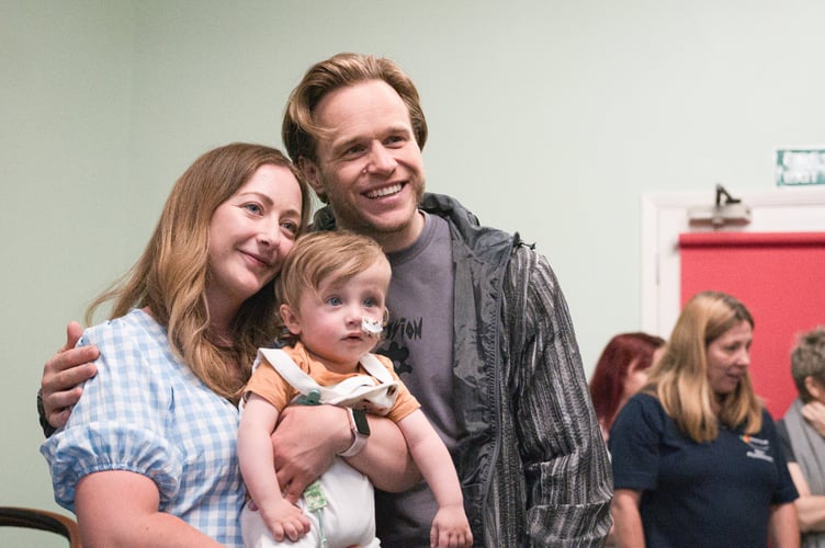 Pop sensation Olly Murs taking time off touring to surprise fans at a children's charity. Photo released June 6 2024. The 'Dance With Me Tonight' singer has been photographed visiting kids at national childrenâs charity Brainwave in Bridgwater, Somerset, in the midst of a huge tour with Take That. The star has been a patron of the charity for the past 13 years and has now had the chance to meet the children who he has been supporting. Brainwave is a charity that exists to help children with disabilities achieve greater independence by aiming to improve their mobility, communication skills and learning potential through a range of specialist therapies.