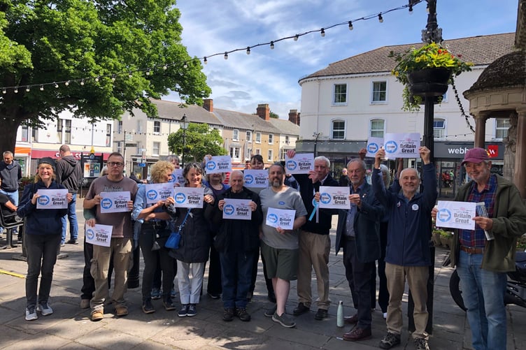 Reform UK's Fred Keen (fourth, right) is pictured with supporters in Minehead at the weekend.