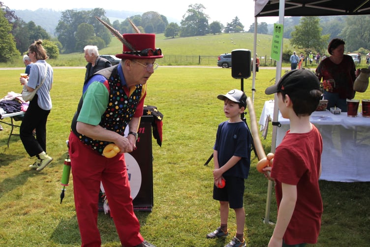 Malcolm the Magician entertains young visitors to Nettlecombe church fete on Saturday.