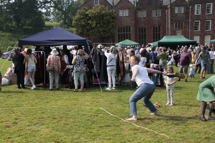 Gemma Smith tries her hand at 'welly hanging' at Nettlecombe church fete.