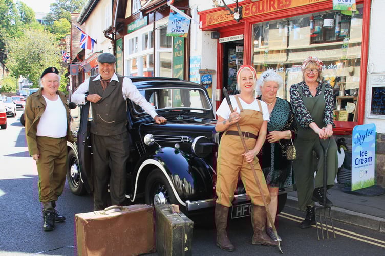 Capturing the spirit of the Second World War in Porlock for the 80th anniversary of D-Day were (left to right) Neil Mead, Richard Growden, Lindsay Harrison, Gill Hill, and Cathy Britton, with Harold the 1939 Morris 12 car.