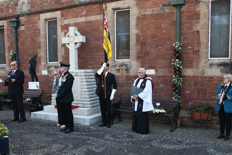 Royal British Legion Somerset chairman Maj Robert Mcdonald (left) gives a short history of Watchet's War memorial during a service to mark its 10th anniversary.