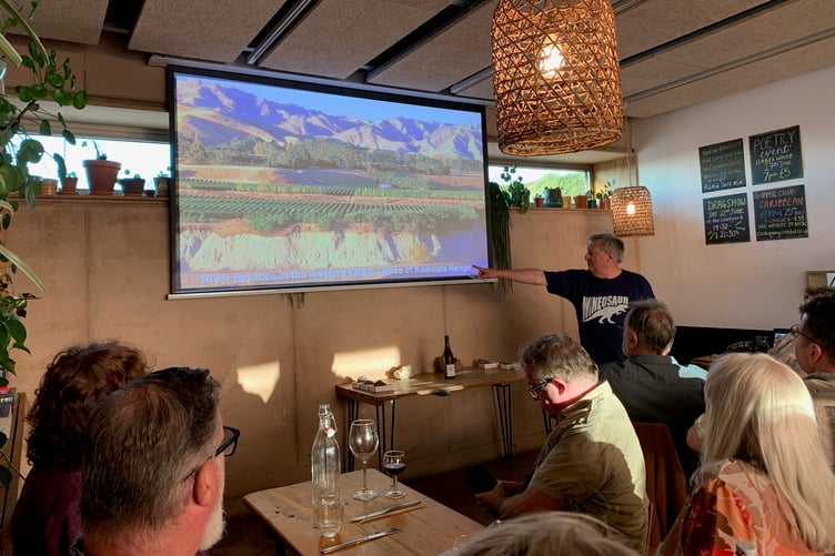 Guests enjoying a geology and wine evening in Watchet hosted by Dr Andy King, of Geckoella.