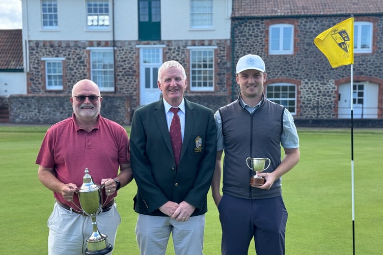 Martin Hole, men's captain (centre), presenting the Championship Trophy to Will Paton (right) and to Ian Gover (left) for the best nett score.