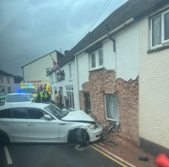 Emergency services attending the scene where a car crashed into a house in Williton. PHOTO: Gosia Ollerenshaw.