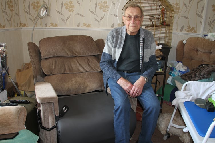 Timberscombe resident John Goodall with the broken reclining chair in which his wife Phyllis became stuck.