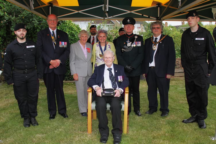 War veteran George Lewis with dignitaries and current members of the Royal Tank Regiment at the presentation of his medals in Watchet.