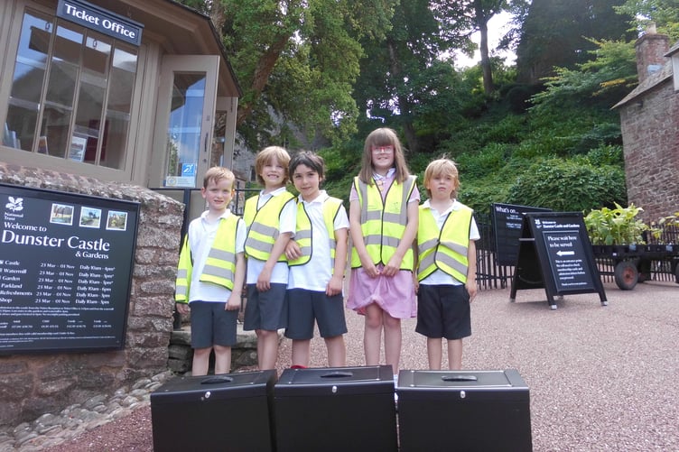 Pupils of Dunster First School returning 'time capsules' to Dunster Castle.