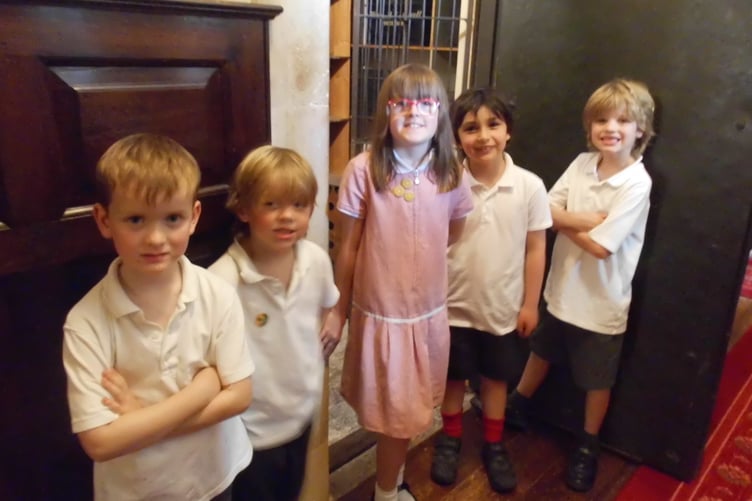 Pupils of Dunster First School who helped lead an exploration of three 'time capsules' stored in Dunster Castle.