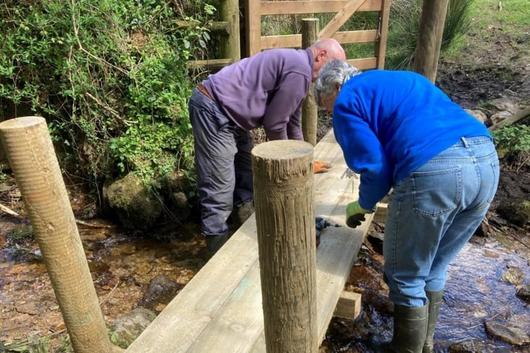 ENPA volunteers helping to fix a bridge connecting paths.