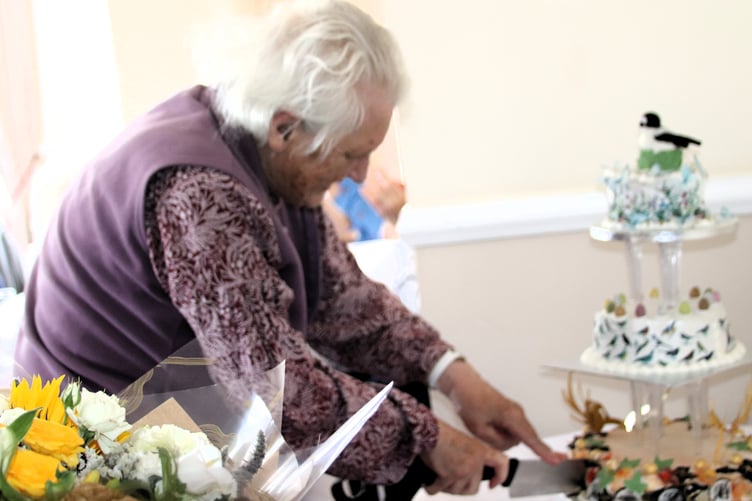 Exmoor Natural History Society secretary and founding member Caroline Giddens cuts a 50th anniversary celebratory cake