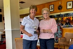 Club Champion Deano Carlin receiving the Hosegood Cup from Ladies President Margaret Gliddon