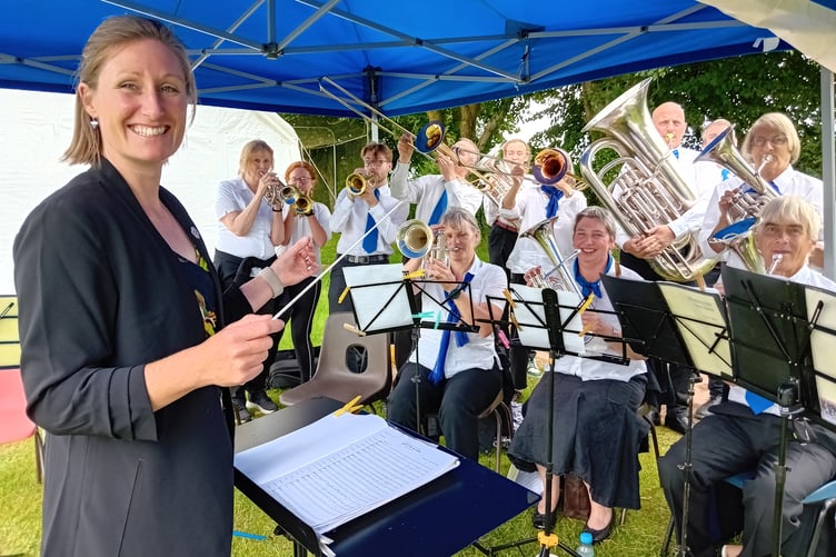 Wiveliscombe Town Band conducted by Charlotte Stus delighted Fitzhead fete goers with their music. PHOTO: Sue Mitchison.