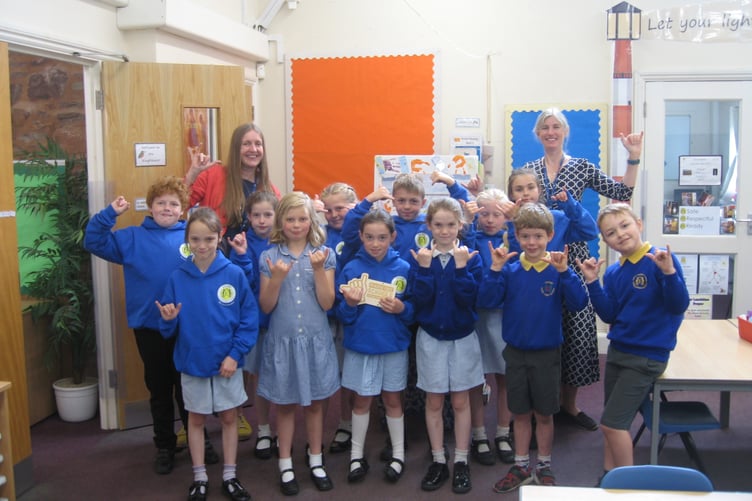 Exford First School's Kingfisher class celebrates achieving Surfers Against Sewage Plastic Free School status.
