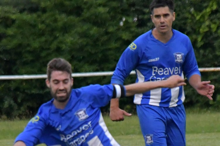 Guy Burns (injured) with new signing George Painter in the background