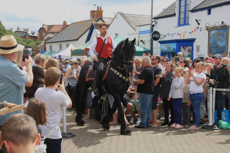 Jonathan Marshall arrives on his 'Lloyds Bank horse' Amadeus for Watchet Street Fair.