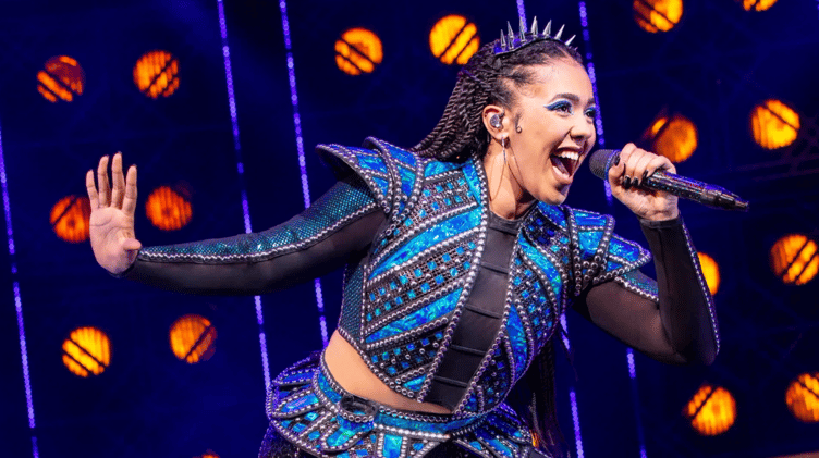 Monique Ashe-Palmer on stage during SIX the Musical