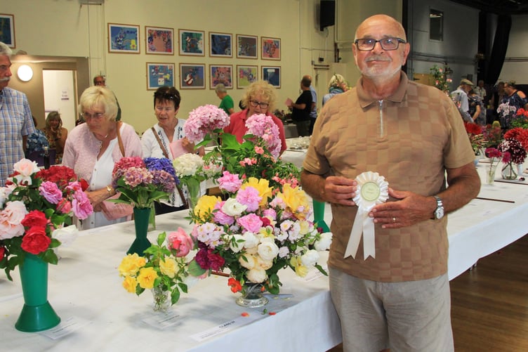 Derek Blay with the best vase of mixed variety roses at Minehead Flower Show.