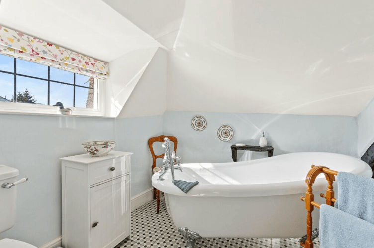 Family bathroom with free standing bathtub