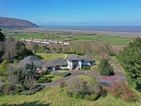 "Impressive" home for sale has ornamental lake and panoramic sea views