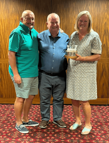 Cob and Pen Mixed Greensomes winners Paul and Gill Hadley Trophy, with centre Peter Swann presenting trophy he donated to the club in 2005