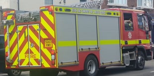 Fire crews called to rescue man trapped on roof of building