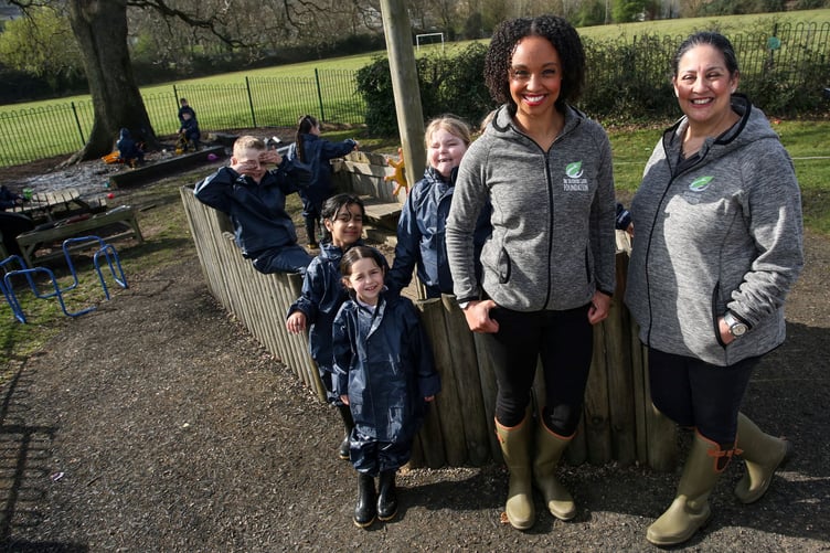 Schoolchildren wearing waterproofs provided through The Outdoor Guide.