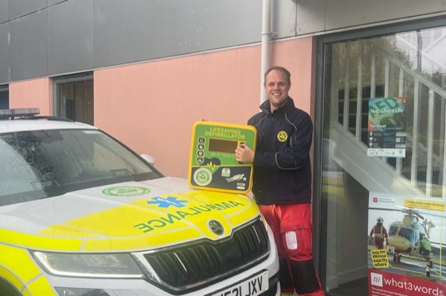 Ollie Zorab with DSAA defibrillator cabinet (Photo: DSAA)