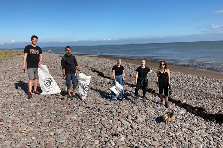 Volunteers taking part in an earlier Dunster Beach clean-up.