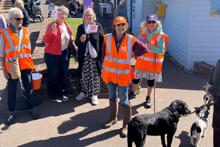 Some of the walkers who raised £1,775 for Home-Start West Somerset with a coastal relay walk are joined by local Cllrs Frances Nicholson and Christine Lawrence (centre).