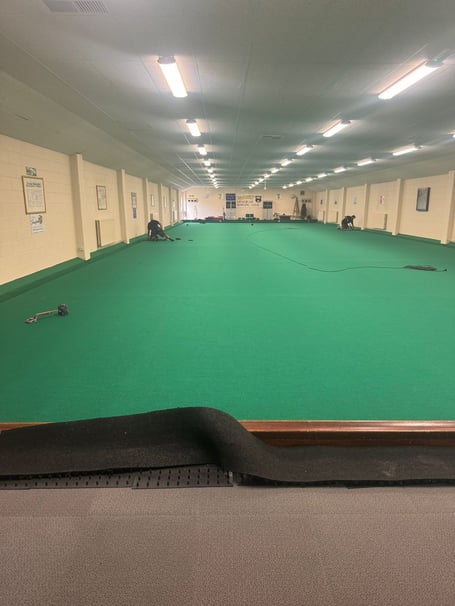 New carpet being laid at Minehead Bowls Club