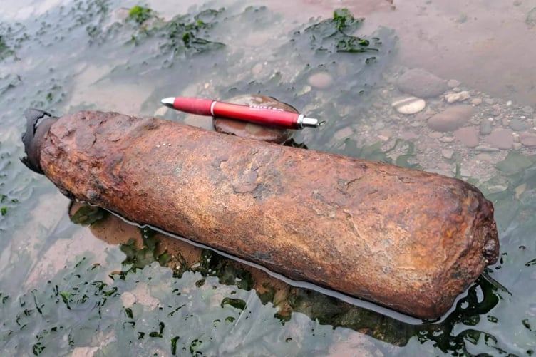 This suspected unexploded wartime bomb was found on the Bristol Channel shoreline in Watchet. A ballpoint pen provides some scale in the photograph. PHOTO: Watchet Coastguard.