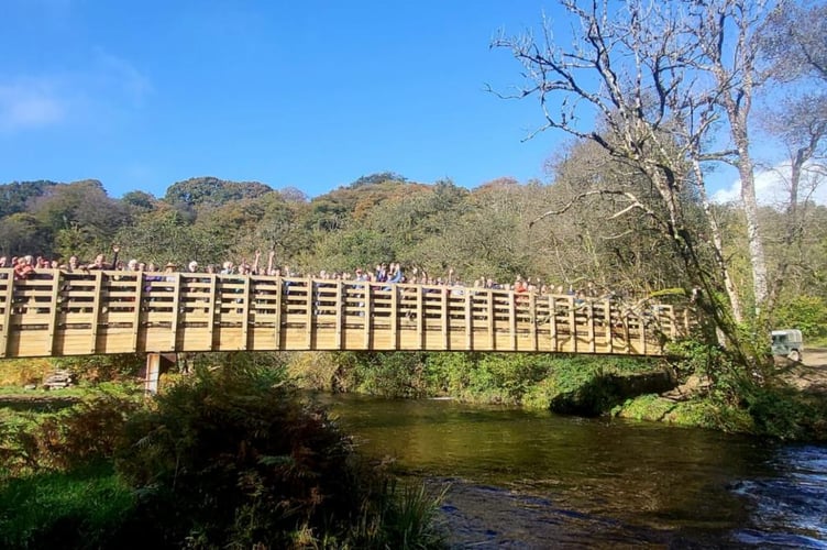 People attending the opening of Great Bradley Bridge, on Exmoor, walk across it for the first time. PHOTO: ENPA.
