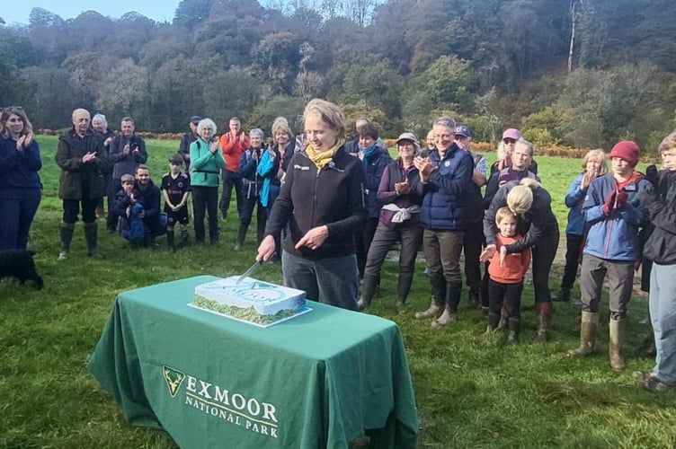 Exmoor National Park Authority chief executive Sarah Bryan cuts a 70th celebration cake. PHOTO: ENPA.