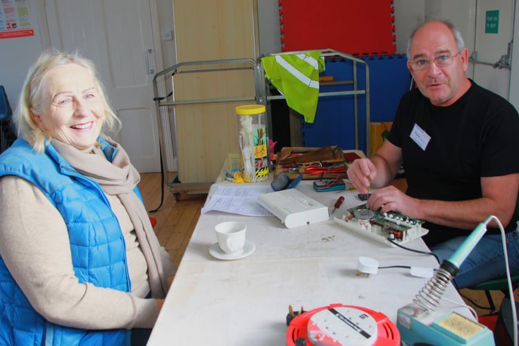 Lynda Edwards has a radio fixed by Paul Weldon at Minehead's new Repair Cafe. PHOTO: George Ody.
