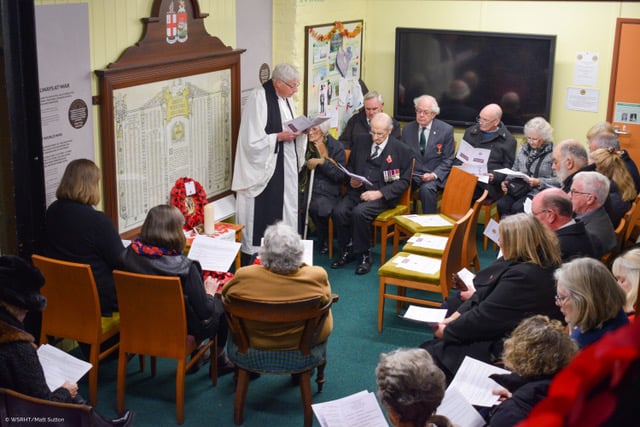 The Rev Martin Parry leads a Remembrance service in the Gauge Museum at Bishops Lydeard station.