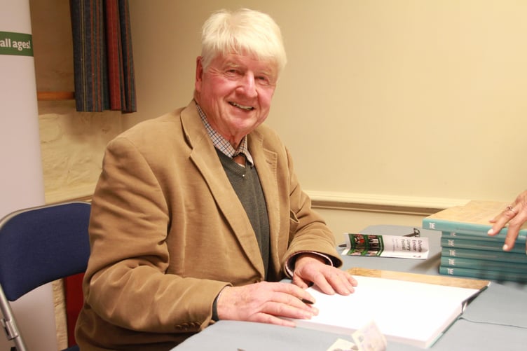 Exmoor's very own Stanley Johnson signs copies of his latest book at the Dulverton Exmoor Literary Festival. PHOTO: George Ody.