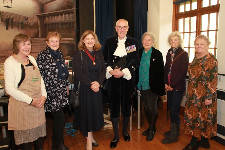 Somerset Deputy Lord Lieutenant Jennifer Duke and High Sheriff of Somerset Rob Beckley (centre) with Roadwater Shop volunteers (left to right) Di Binding, Claire Sawatzky, Mary Coles, Cherry Bird, and Sheila Robertson. PHOTO: George Ody.
