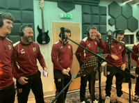 Football players hoping to score with Christmas song