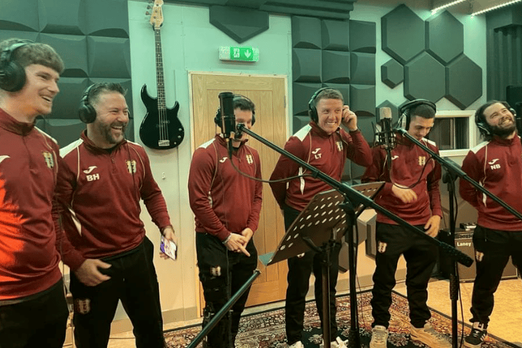 Alcombe Rovers football players in the recording studio to rehearse their fund-raising Christmas song.