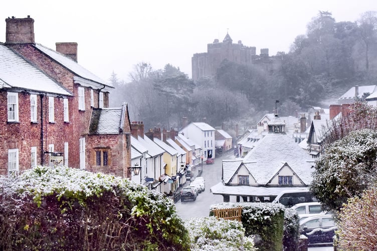 A view of snow-dusted Dunster where a new Christmas festival is being held in December. PHOTO: Nina Dodd.