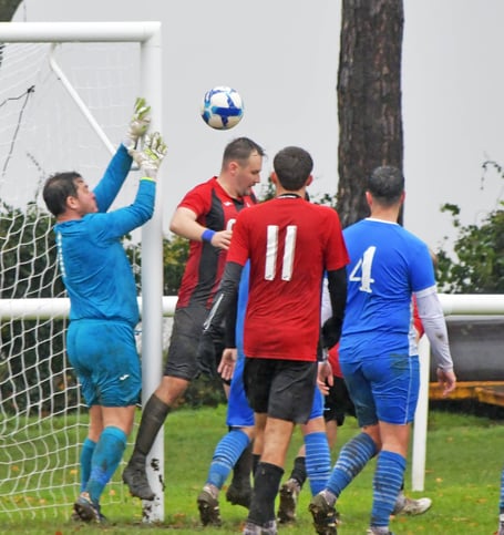 Watchet goalkeeper Vinnie Jones in action against Bishop Sutton