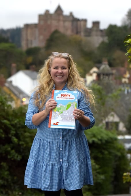 Nina Dodd with her children's book ‘Poppy - The Ghost Hunter of Dunster’. PHOTO: All Dodd.
