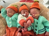 Couple who struggled to conceive 'couldn't be happier' with triplets