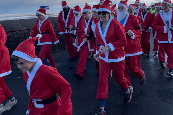 Runners of all ages and abilities joined Rotary Club of Minehead's annual Santa fun run.
